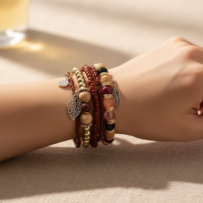 Woman Wearing Elastic Boho Bracelet - Wrist Close Up with Gemstone Beads and Silver Charms