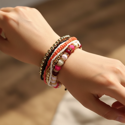 Woman Wearing Red Boho Bracelet - Wrist Close Up with Vibrant Beads